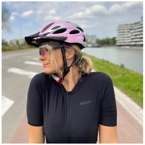 Bicycle Helmet Women - Matte Pink-Gray - side view with sun visor woman model